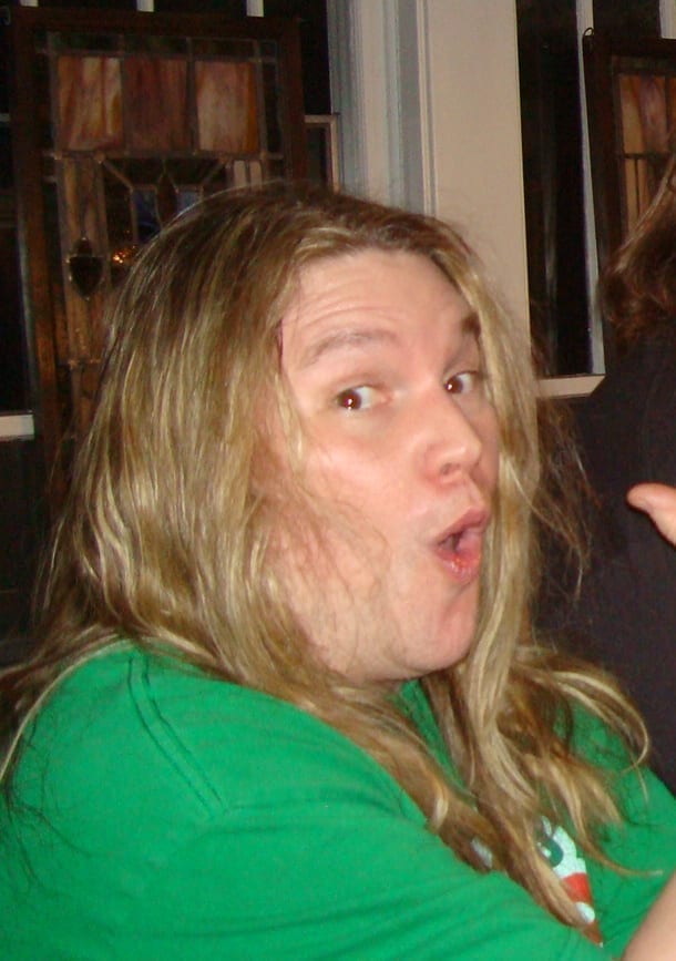 Reed Mullin looks toward the camera with an animated expression, photographed indoors in 2009.